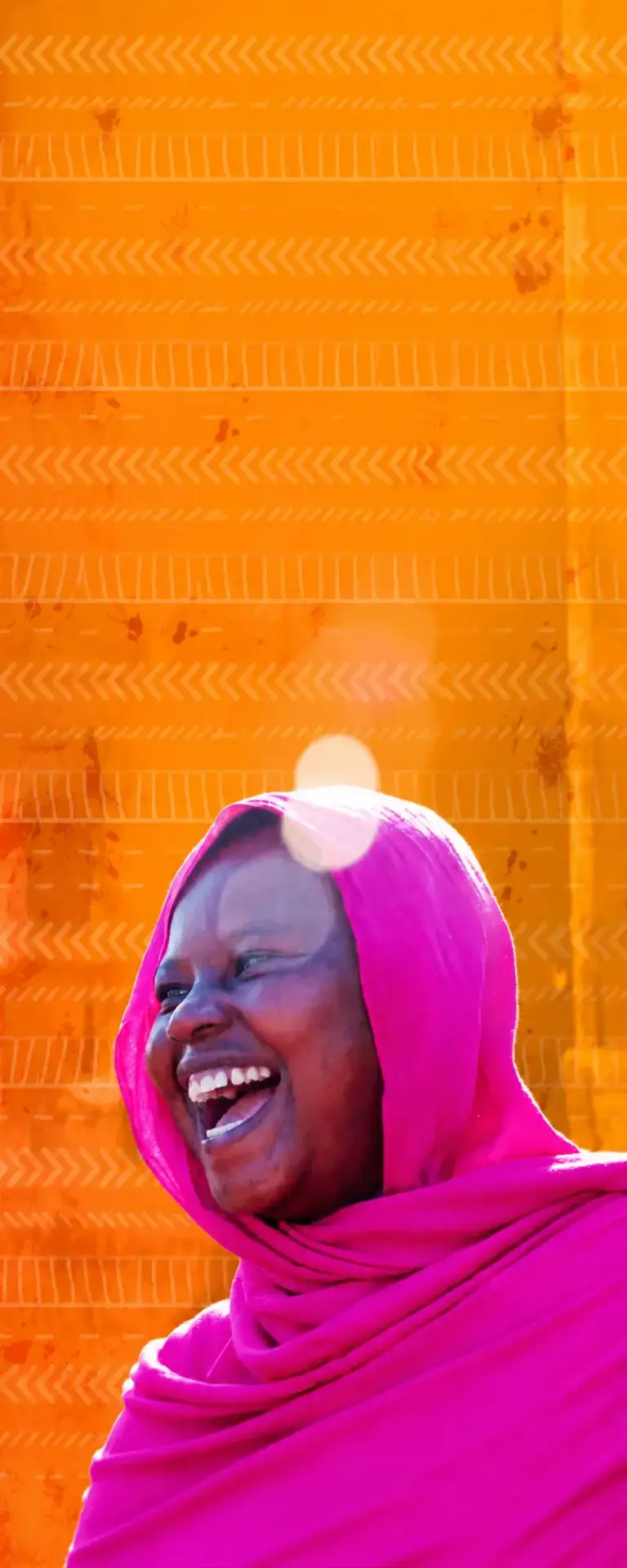 Joyful woman with vibrant tribal backdrop